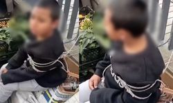 2025 İstanbul'unda skandal görüntü! Pazarda eşofman çalan çocuğu iple bağladılar